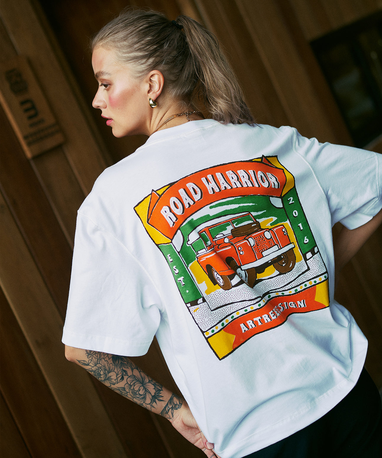 Oversized cropped white unisex t-shirt with vintage Land Rover graphic on back – Road Warrior design by Artree