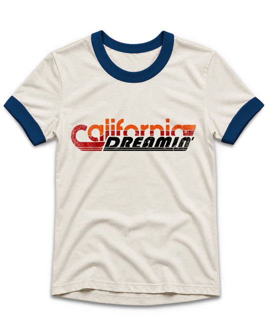 An off-white ringer t-shirt with navy blue collar and sleeve cuffs, featuring a distressed red and black 'California Dreamer' graphic across the chest.