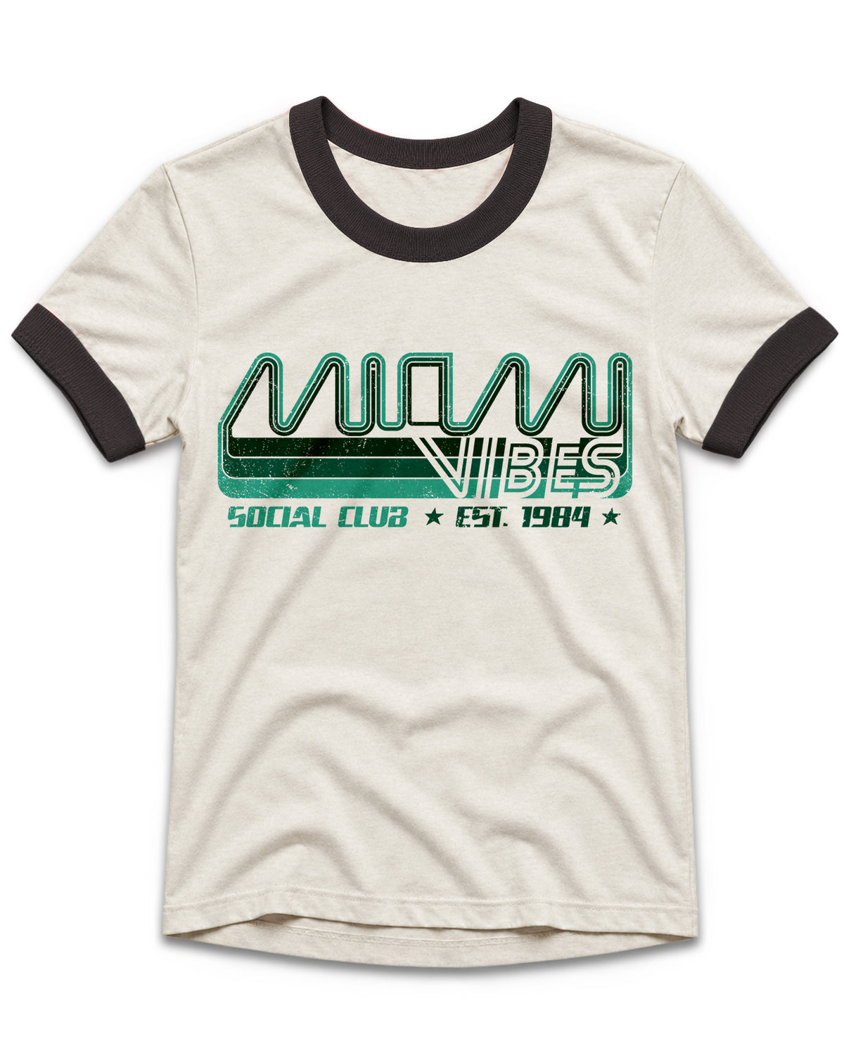 An off-white ringer t-shirt with black ribbed collar and sleeve cuffs, featuring a green and black graphic print on the front that reads 'MIAMI VIBES SOCIAL CLUB EST. 1984'.