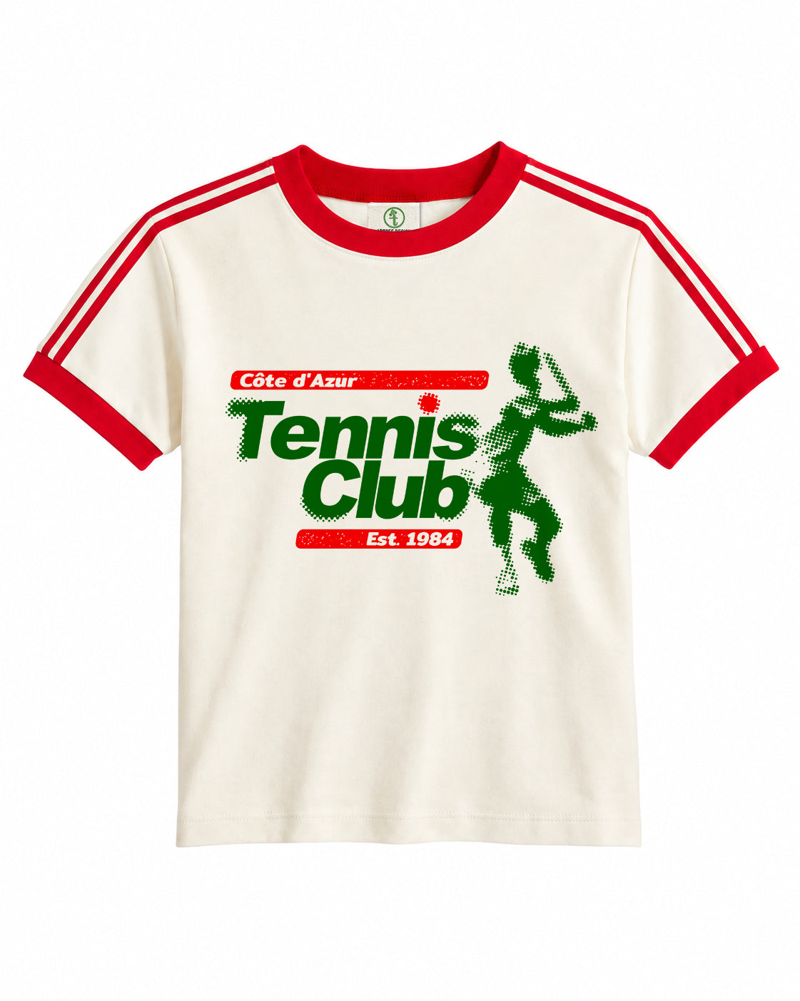 An off-white ringer t-shirt with red collar and sleeve trim, featuring a green and red graphic print on the front that reads 'Côte d'Azur Tennis Club Est 1984' alongside a tennis player silhouette.